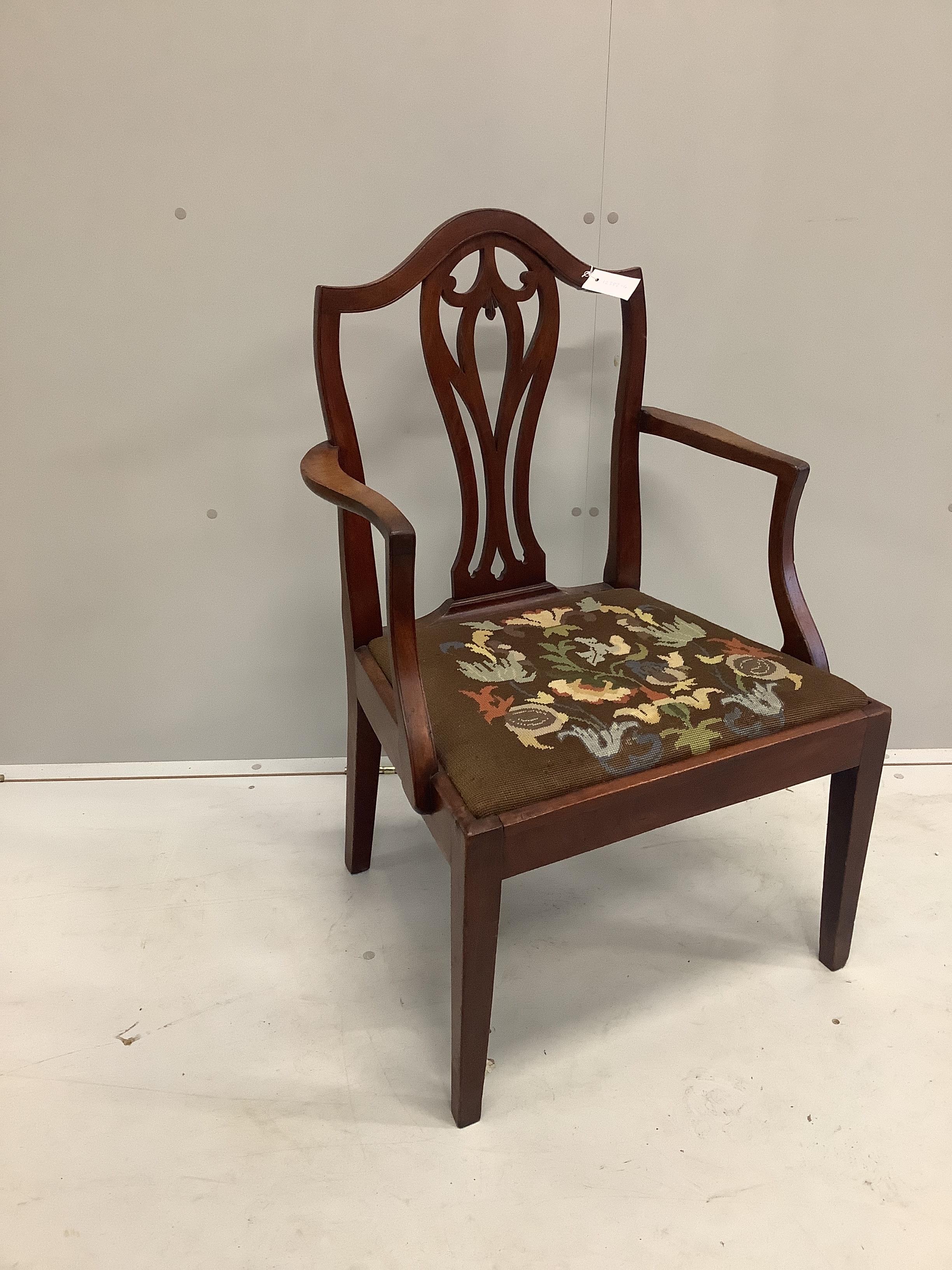 A George III mahogany elbow chair with tapestry seat, width 58cm, depth 45cm, height 92cm